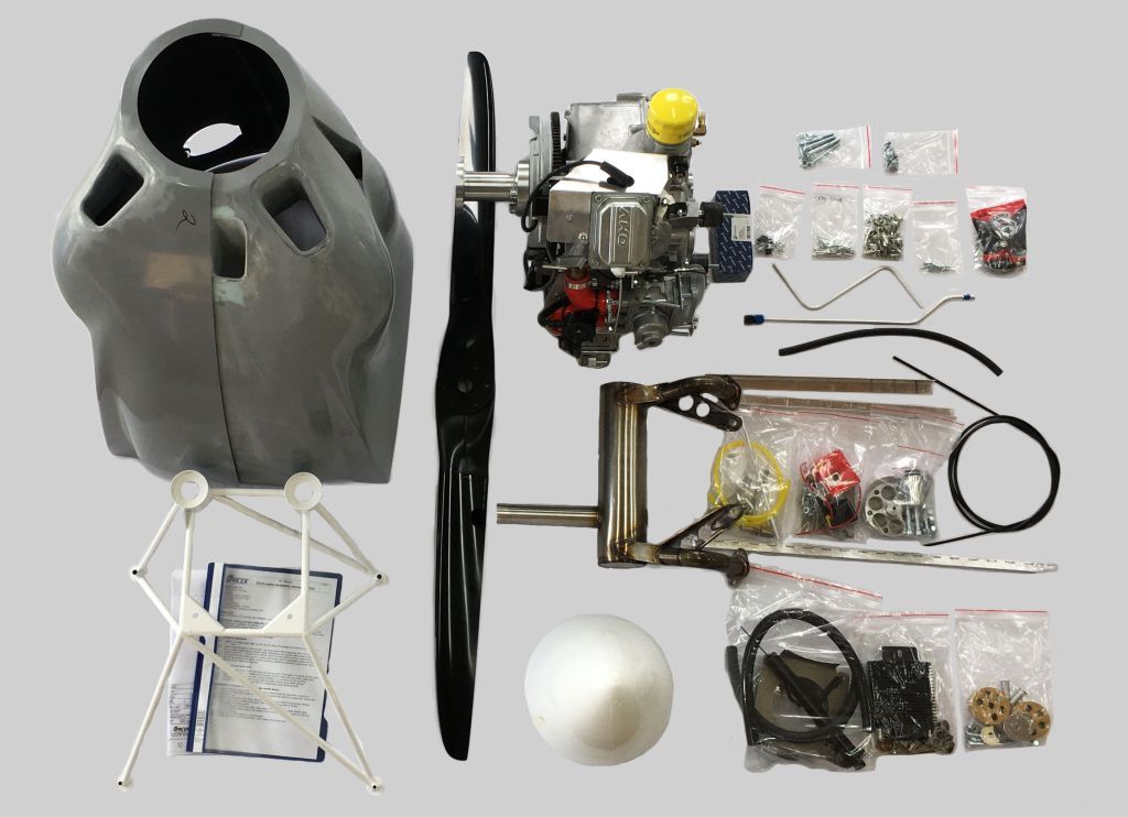 An SE33I XP firewall-forward kit laid out: engine, cowling, propeller, mount, spinner and hardware